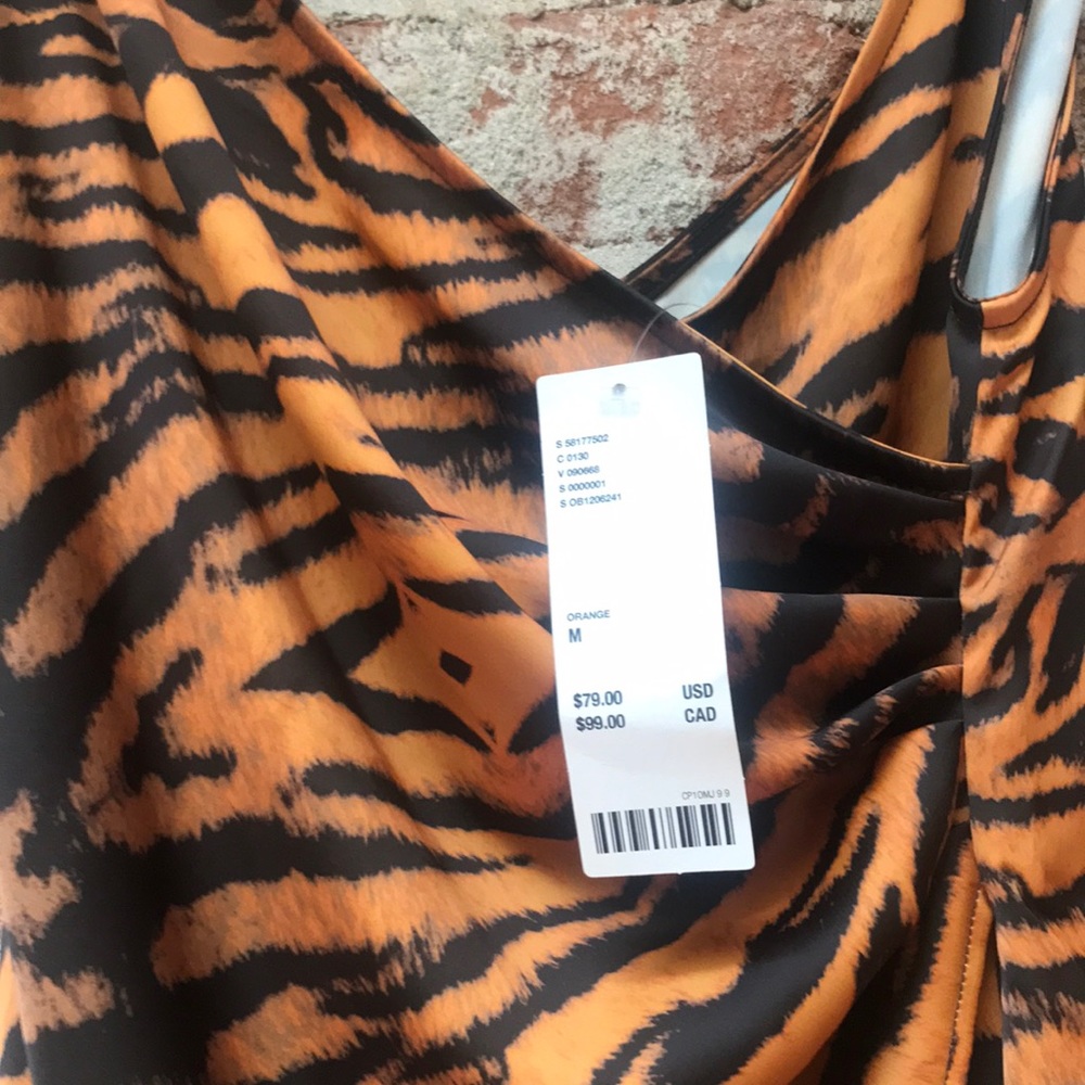Tiger print, wrap dress. Midi, spaghetti straps.